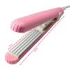 Un mini fer à cheveux plaque ondulée rose fer à friser électrique outils de modélisation de boucles